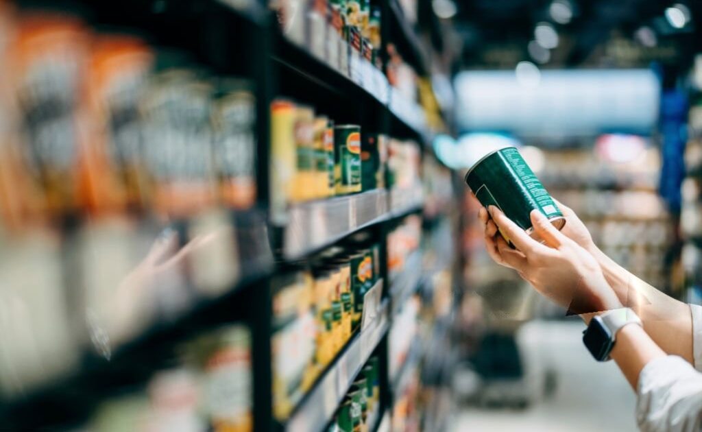 Food ingredients supplier checking ingredient labels on packaged food products