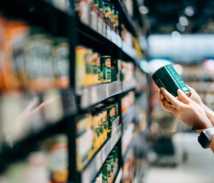 Food ingredients supplier checking ingredient labels on packaged food products