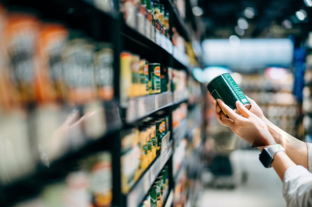 Food ingredients supplier checking ingredient labels on packaged food products